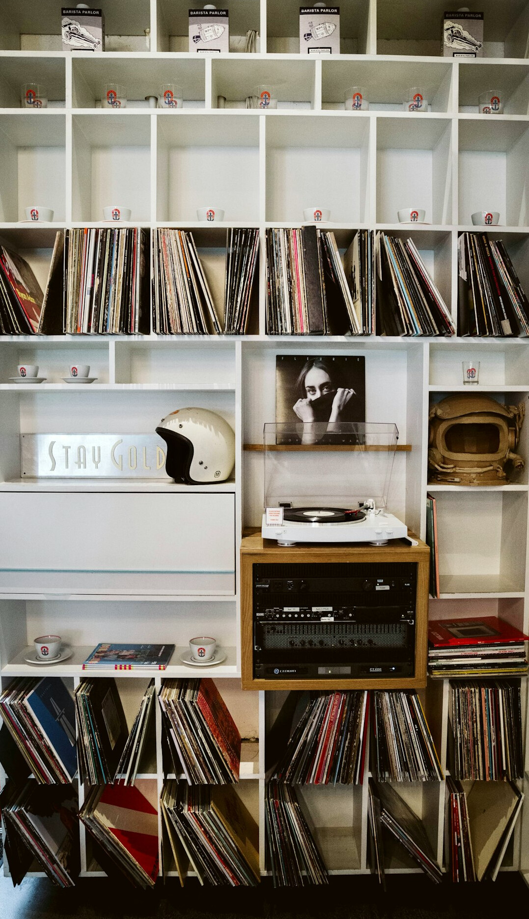 Shelves full of vintage design books and records